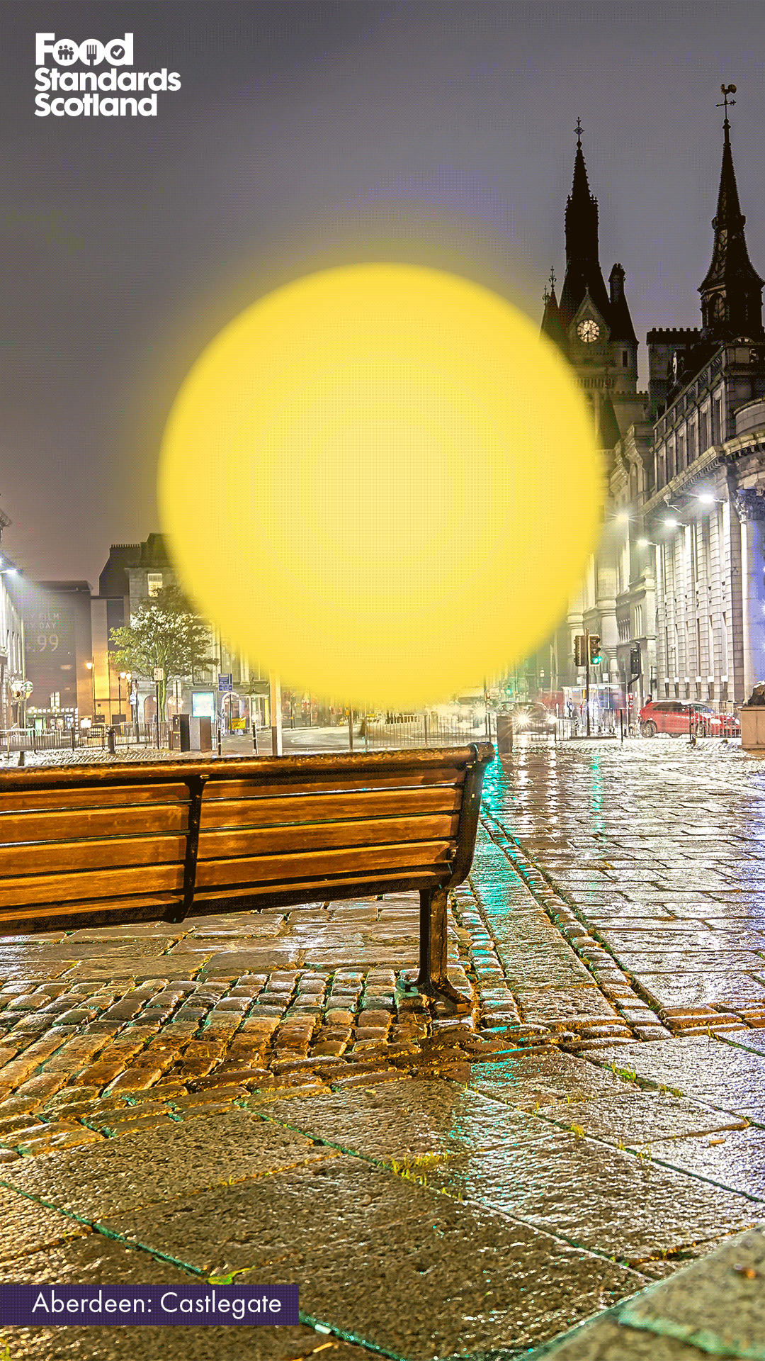 Castlegate in Aberdeen with dark weather and a sun shining