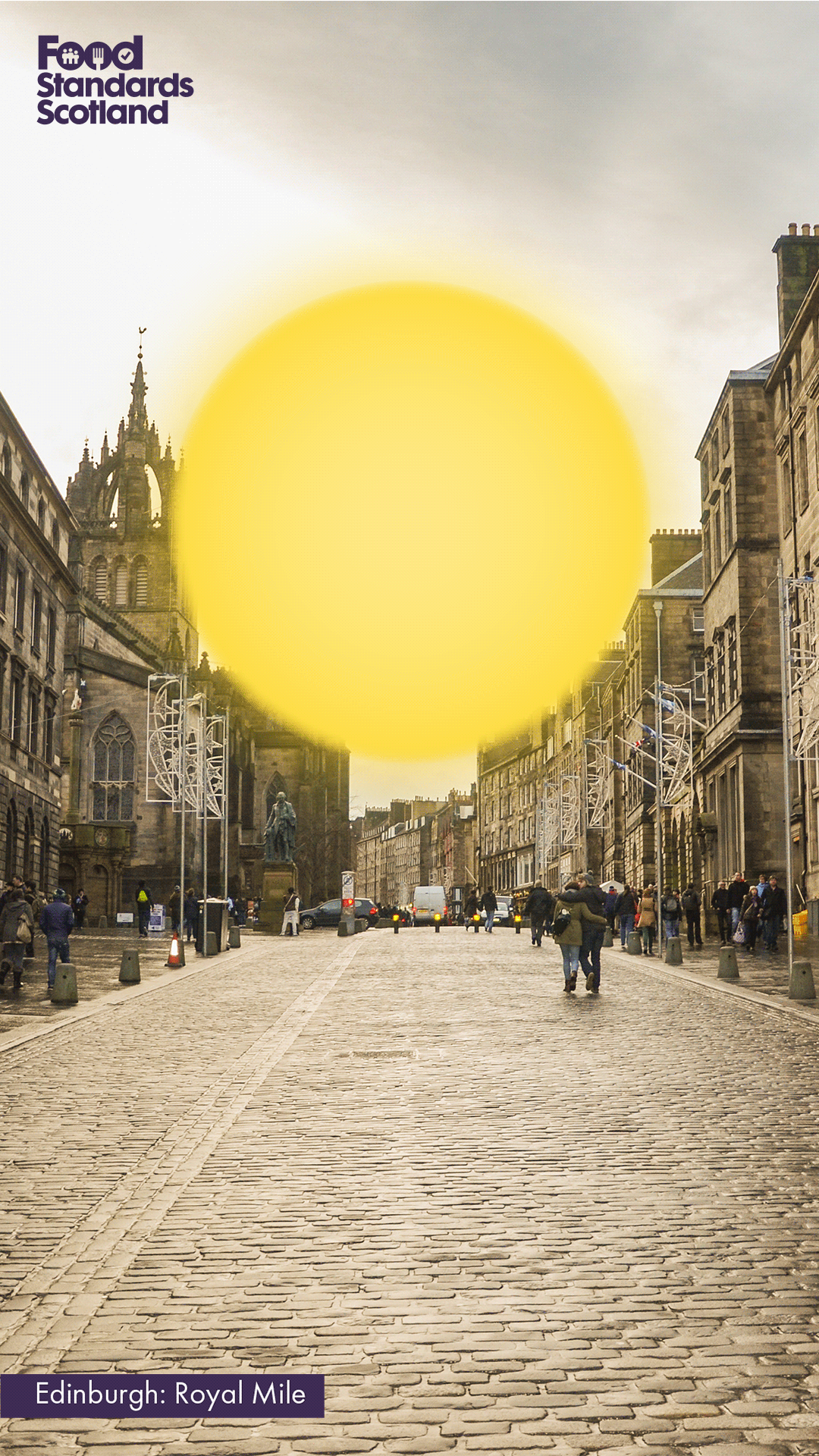 Dull image of Edinburgh with a sun shining over the top