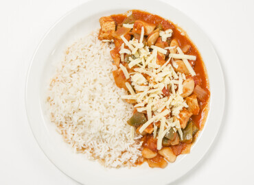 Spicy chicken and butter-bean stew with brown rice and grated cheese