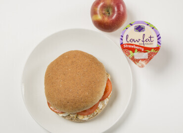 Egg and tomato mayonnaise on a wholemeal roll, followed by a low fat fruit yogurt and an apple