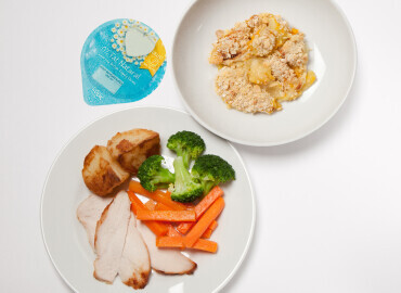 Roast chicken with potatoes and vegetables, homemade apple crumble and a pot of plain yogurt 