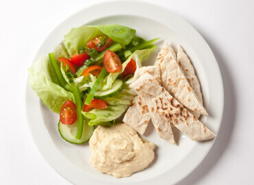 Pitta bread with houmous and a side salad 
