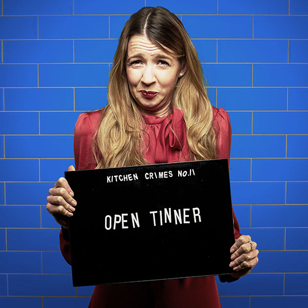 Mock mug shot photograph of a man holding a sign saying kitchen crimes number 1: open tinner